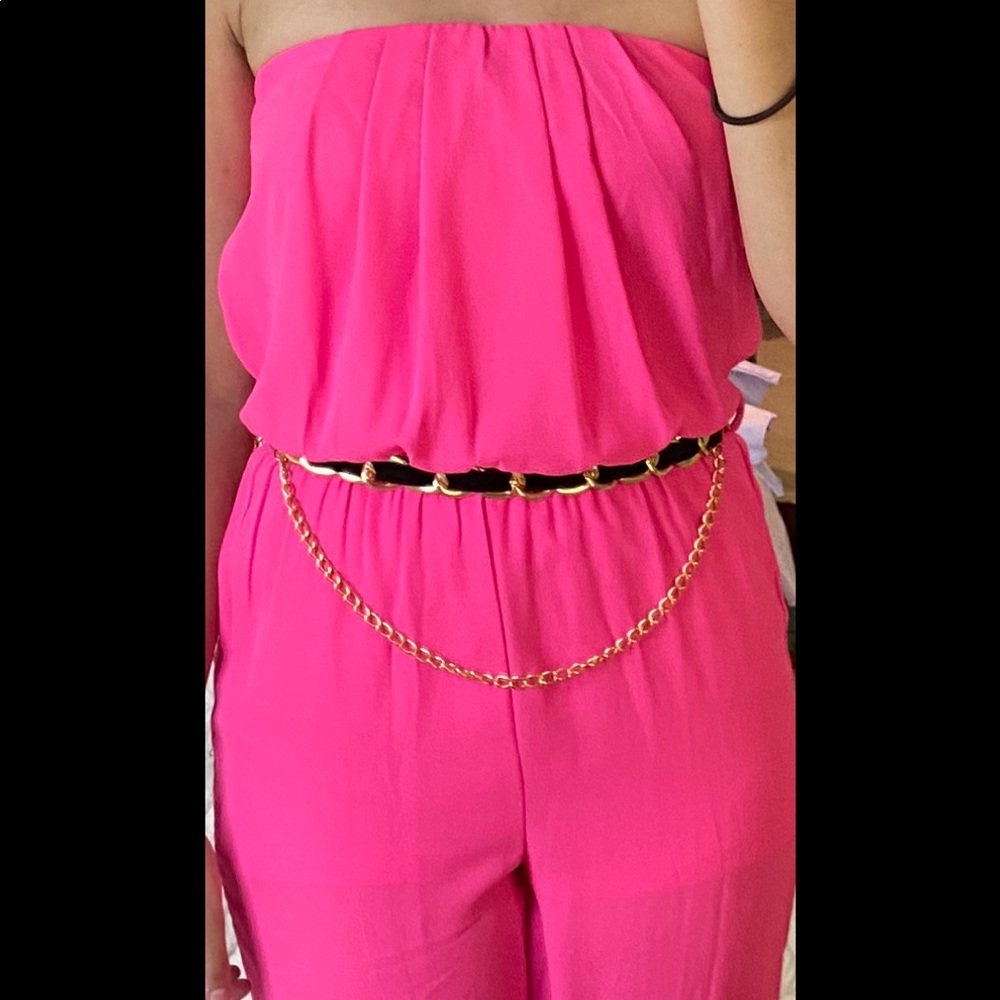 Fuchsia strapless jumper with black and gold belt